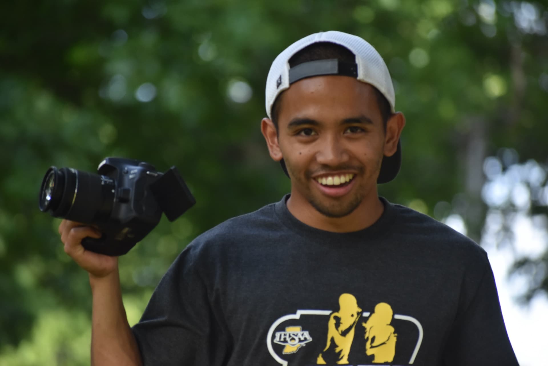 Photographer capturing camp activities at Camp Otyokwah